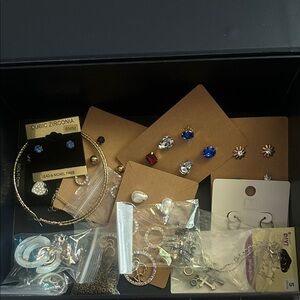 Box of costumes jewelry mainly earrings